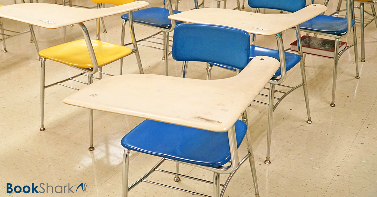 blue and yellow school desks in rows